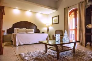 Cama ou camas em um quarto em Tenondé Park Hotel
