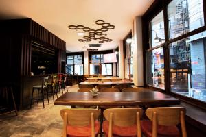 a restaurant with a row of tables and chairs at West Palace in Istanbul