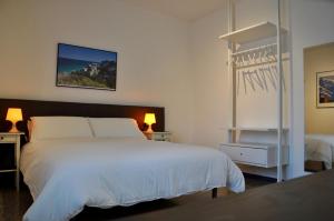 A bed or beds in a room at LoLè Apartment - Ancona