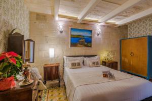 Postel nebo postele na pokoji v ubytování Valletta Lucente Guest House