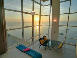 a large room with a view of the ocean at Maritime Suites by Comfy in George Town