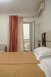 Posteľ alebo postele v izbe v ubytovaní Aeolis Boutique Hotel