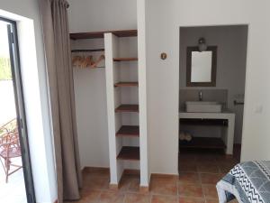 a bathroom with a sink and a mirror at Finca Mirador in Macastre