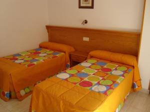 Postel nebo postele na pokoji v ubytování Hostal Vinuesa