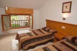 Postel nebo postele na pokoji v ubytování Hostal Vinuesa
