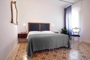 Postel nebo postele na pokoji v ubytování Carrara Bella