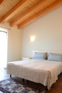 Postel nebo postele na pokoji v ubytování B&B Al Lauro