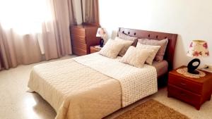 Postel nebo postele na pokoji v ubytování Mahdia Place Apartments