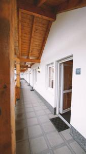 a hallway of a house with wooden ceilings at Landgasthof Scherer in Wenden
