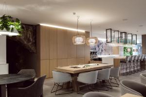 a dining room with a table and chairs at Hotel Juliani - Boutique Hotel in St. Julianʼs
