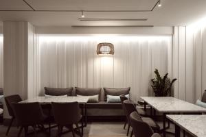 a dining room with a table and chairs at Hotel Juliani - Boutique Hotel in St. Julianʼs