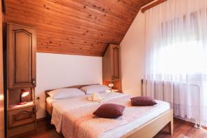 Кровать или кровати в номере Plitvice House Milan