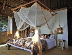 A bed or beds in a room at Jabar Lodge