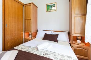 Postel nebo postele na pokoji v ubytování Plitvice House Milan