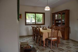 a dining room with a table and chairs at Cherry Cottage in Kato Platres