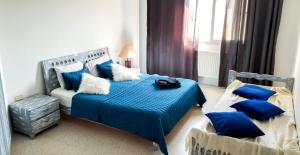 Postel nebo postele na pokoji v ubytování Mahdia Place Apartments