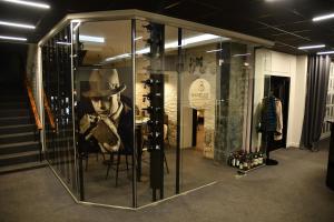 a glass display case with a man in a cowboy hat at Hotel Voyager in Moscow