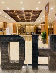 a lobby with a large lobby with a building at Dar Hashim Hotel Suites - Alnuzha in Riyadh