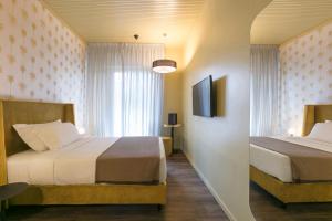 Säng eller sängar i ett rum på Motel Peralba