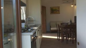 Kuchyň nebo kuchyňský kout v ubytování Residence Colle Veroni