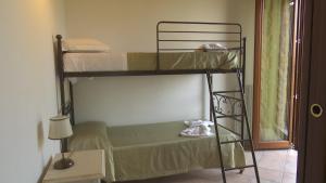Postel nebo postele na pokoji v ubytování Residence Colle Veroni