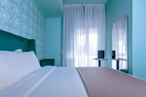 Postel nebo postele na pokoji v ubytování Hotel Mealba