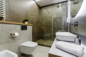Kúpeľňa v ubytovaní Krakowiak Apartments + 27 fotografií
