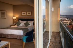 Ένα ή περισσότερα κρεβάτια σε δωμάτιο στο Ambassador Boutique Hotel - Jerusalem