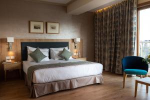 Ένα ή περισσότερα κρεβάτια σε δωμάτιο στο Ambassador Boutique Hotel - Jerusalem