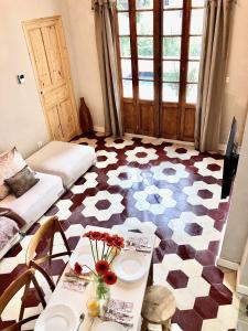a living room with a checkered floor at VILLA CAMPANA - Bastia centre in Bastia