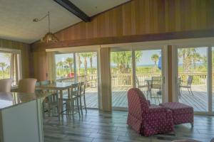 a dining room with sliding glass doors and a patio at Oceanview Lodge - Saint Augustine in St. Augustine