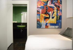 A bed or beds in a room at Atmosfere Puniche b&b