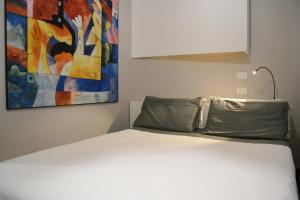 A bed or beds in a room at Atmosfere Puniche b&b