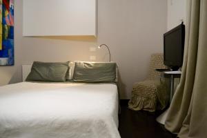 A bed or beds in a room at Atmosfere Puniche b&b