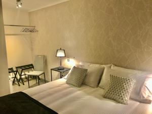 En eller flere senge i et værelse på Patagonia Apart Hotel - Suite