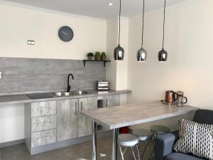 Kuchyň nebo kuchyňský kout v ubytování Patagonia Apart Hotel - Suite