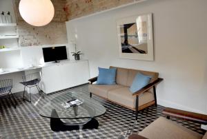 a living room with a couch and a table at Guesthouse Bernardin in Antwerp