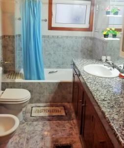 a bathroom with a sink and a tub and a toilet at Casa da Fátima, in Vila Chã