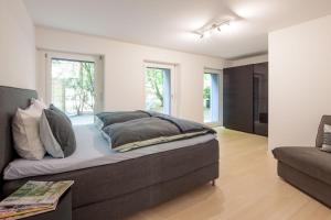 Khu vực ghế ngồi tại 2,5 Zi Design Loft Wohnung mit Gartensitzplatz