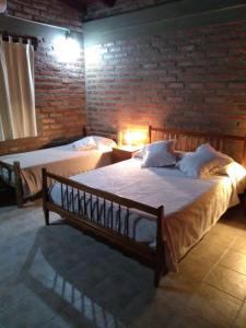 Giường trong phòng chung tại El Indalo La Calderilla