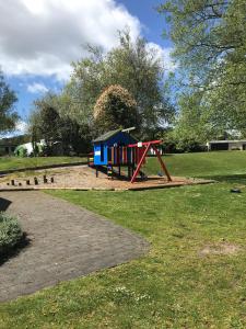 a playground in a park with a playground at Rotorua Thermal Holiday Park in Rotorua