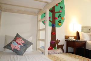Voodi või voodid majutusasutuse Yoho Beach Resort Kenting toas