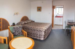 Postel nebo postele na pokoji v ubytování New Haven Motel