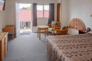Postel nebo postele na pokoji v ubytování New Haven Motel + 37 fotografií
