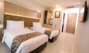Katil atau katil-katil dalam bilik di Hotel Daily Inn
