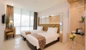 Katil atau katil-katil dalam bilik di Hotel Daily Inn