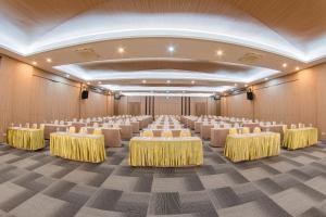 a banquet hall with tables and chairs in a room at Panlaan Boutique Resort in Nong Khai