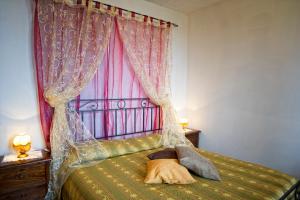 Säng eller sängar i ett rum på Agriturismo Pescaia