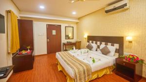 Ein Bett oder Betten in einem Zimmer der Unterkunft Esthell Village Resort