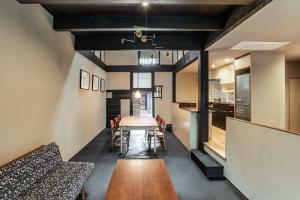 a kitchen and dining room with a table and chairs at Kyo no Ondokoro NISHIJIN VILLA #5 in Kyoto